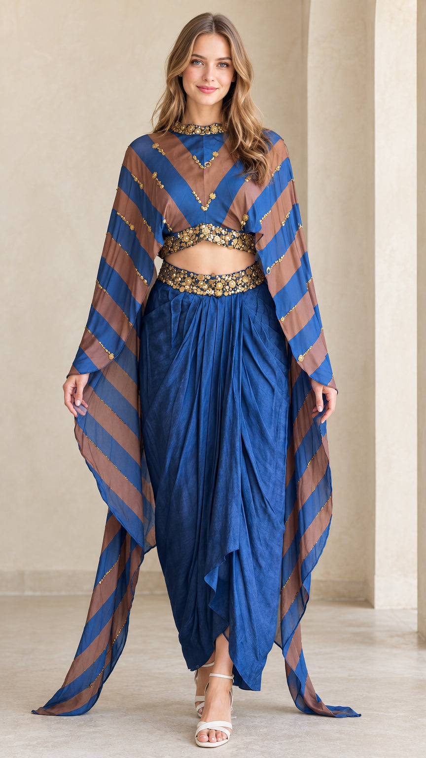 Front view of model wearing Royal Blue striped cape crop top and draped dhoti pant set