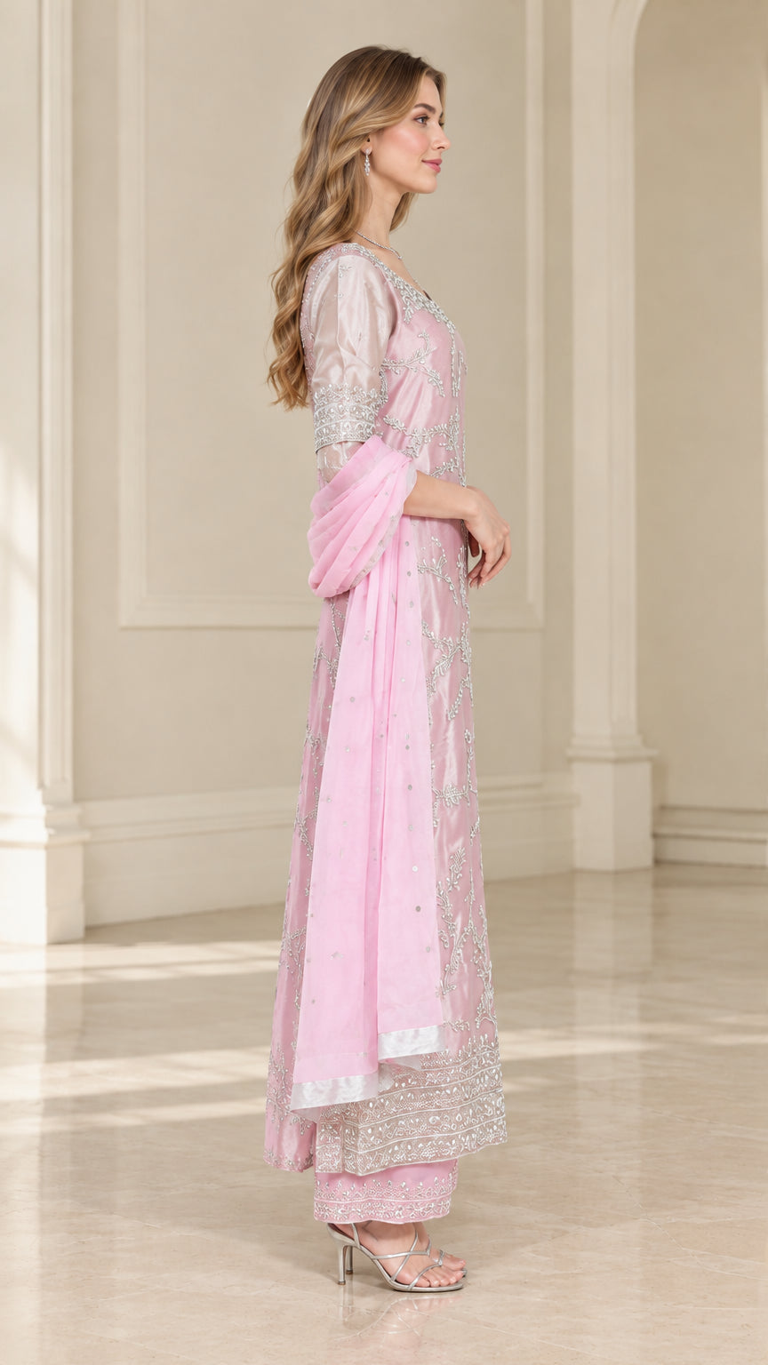 Side view of model wearing Blush Pink embroidered kurta suit ensemble