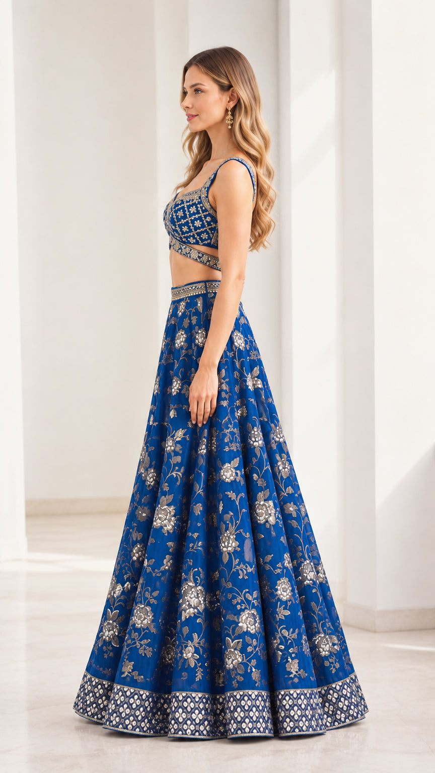Side profile view of royal blue sleeveless crop top and flared lehenga skirt