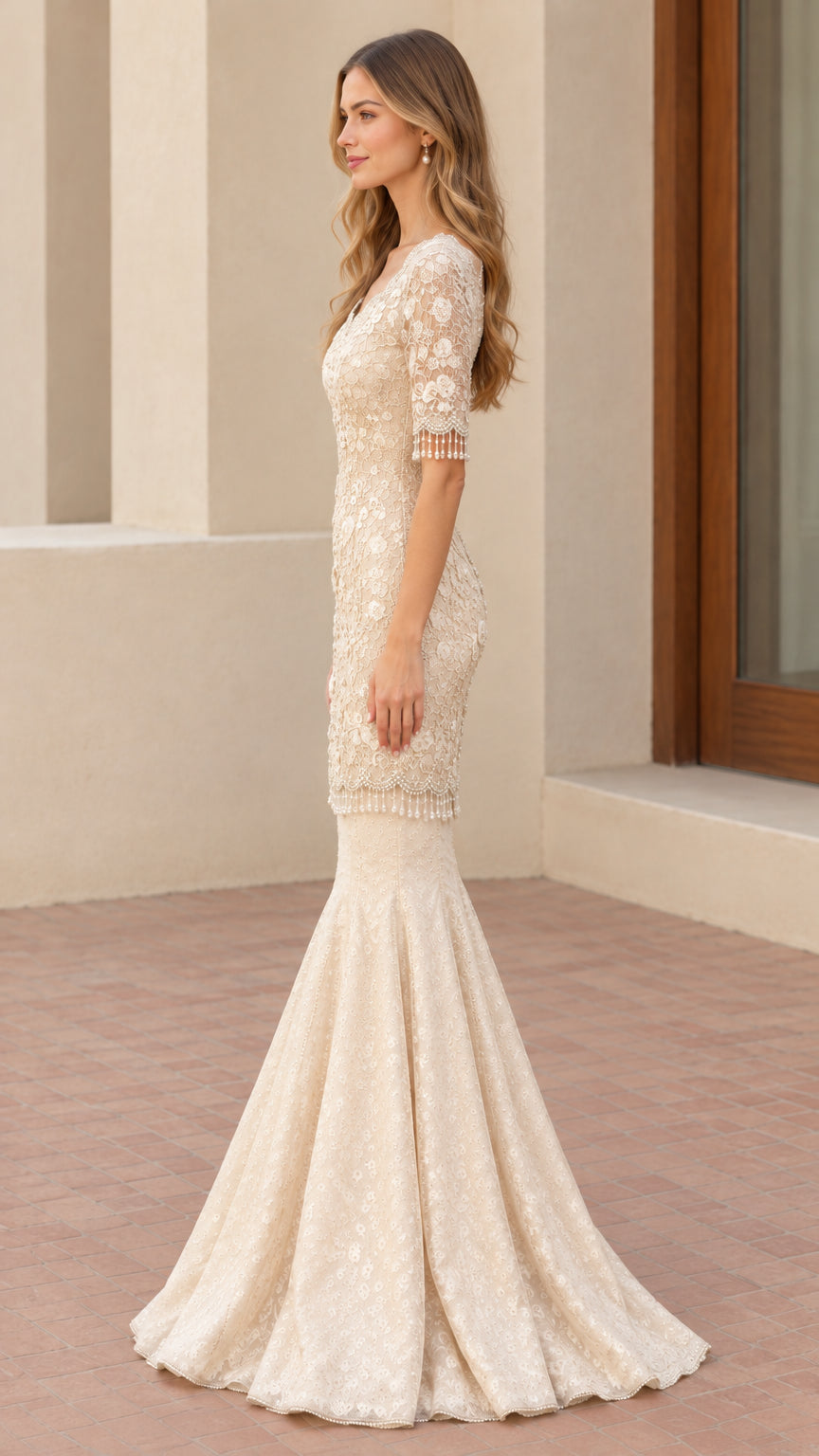 Side profile view of champagne lace mermaid gown highlighting fluted skirt silhouette