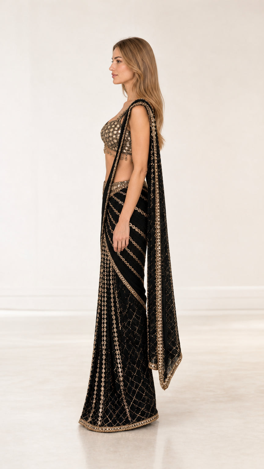 Side angle view of woman wearing black embroidered ready-to-wear saree set