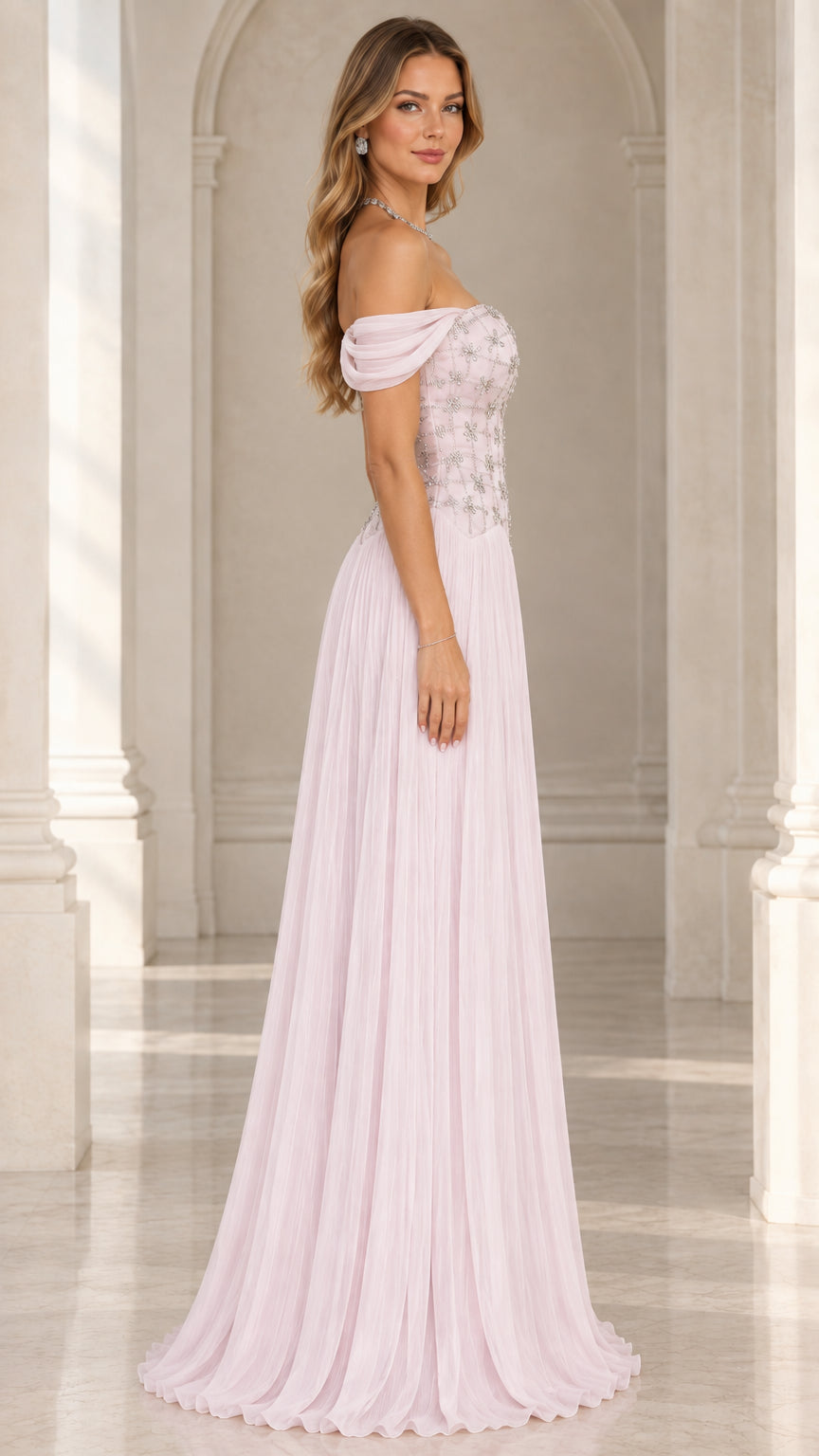 Side profile view of blush pink pleated chiffon evening dress with crystal bodice