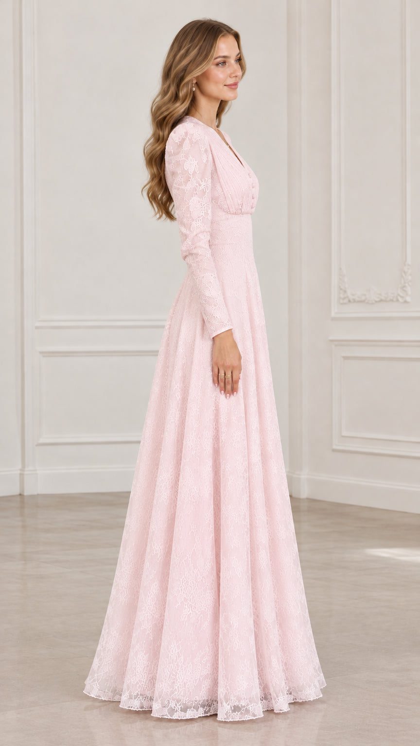 Side profile of woman wearing floor-length blush pink lace formal gown
