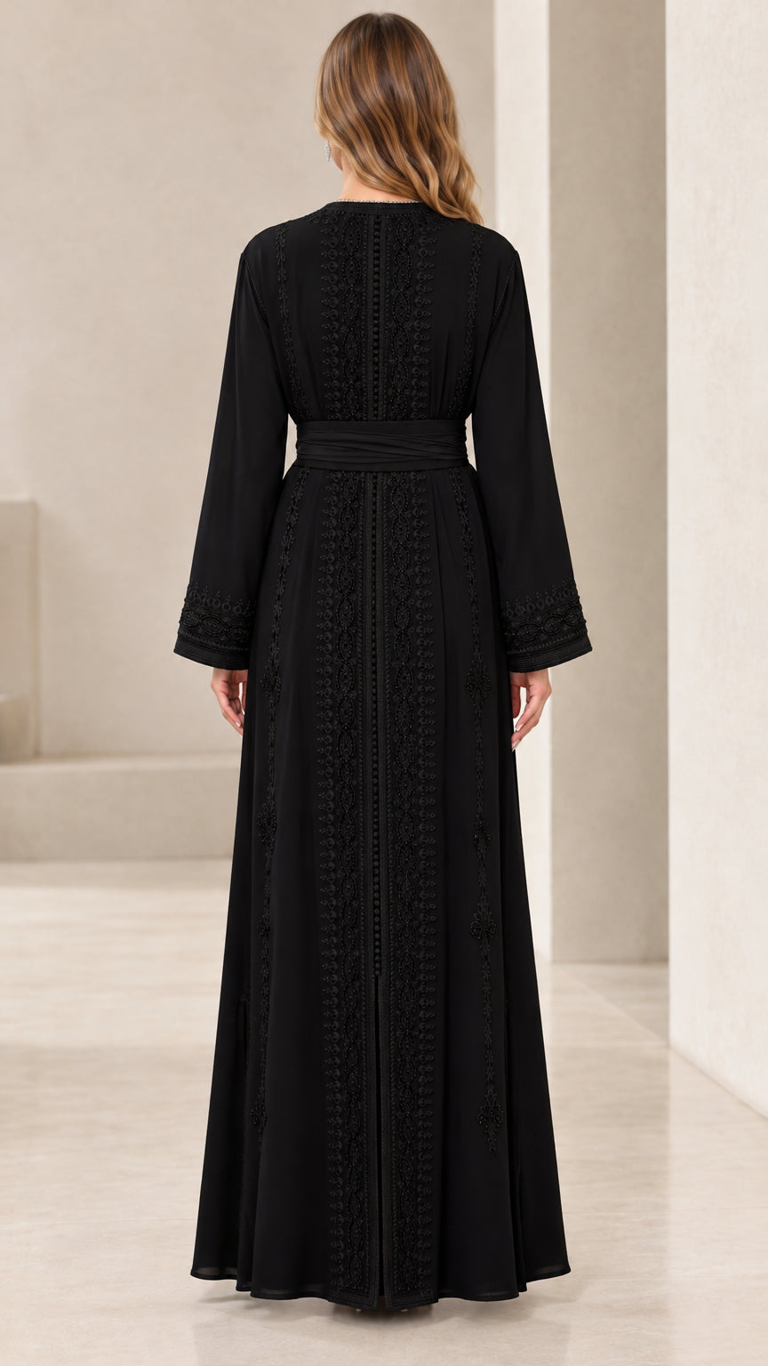 Back view of black long sleeve belted maxi dress