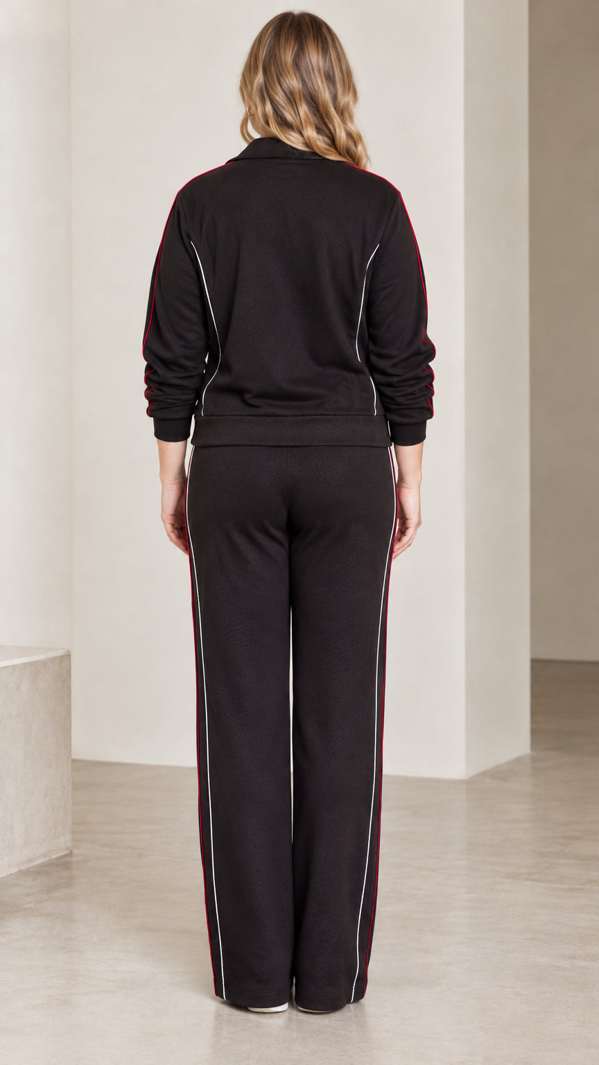 Back view of model wearing the black wide-leg tracksuit set