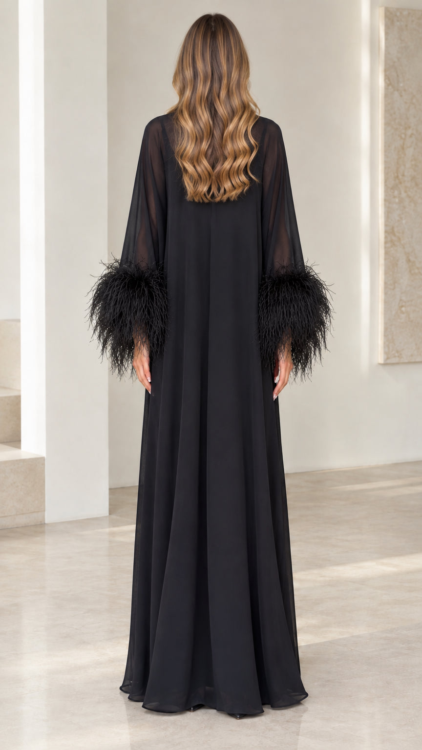 Back view of floor-length black sheer yoke evening gown