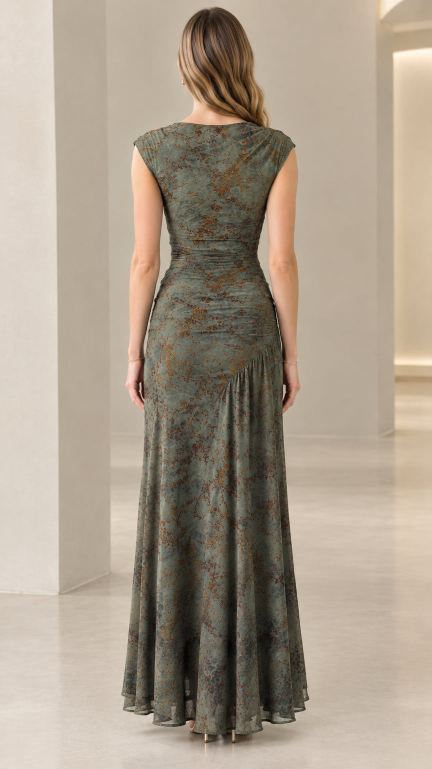 Back view of model wearing sleeveless olive green floral maxi dress