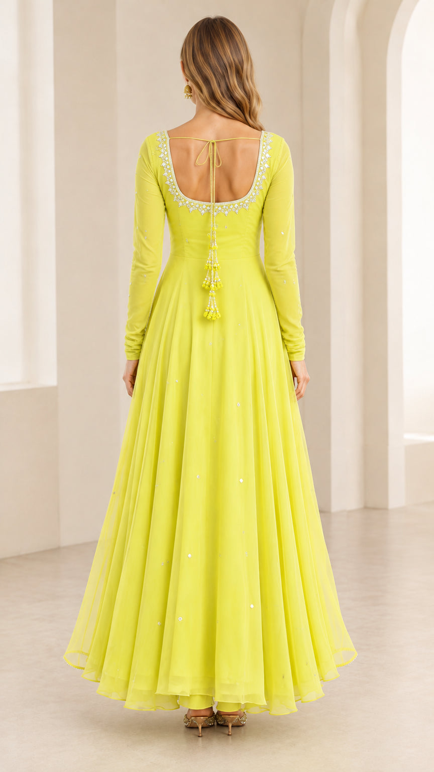 Back view of Lime Green Anarkali gown showing open back with hanging tassel details