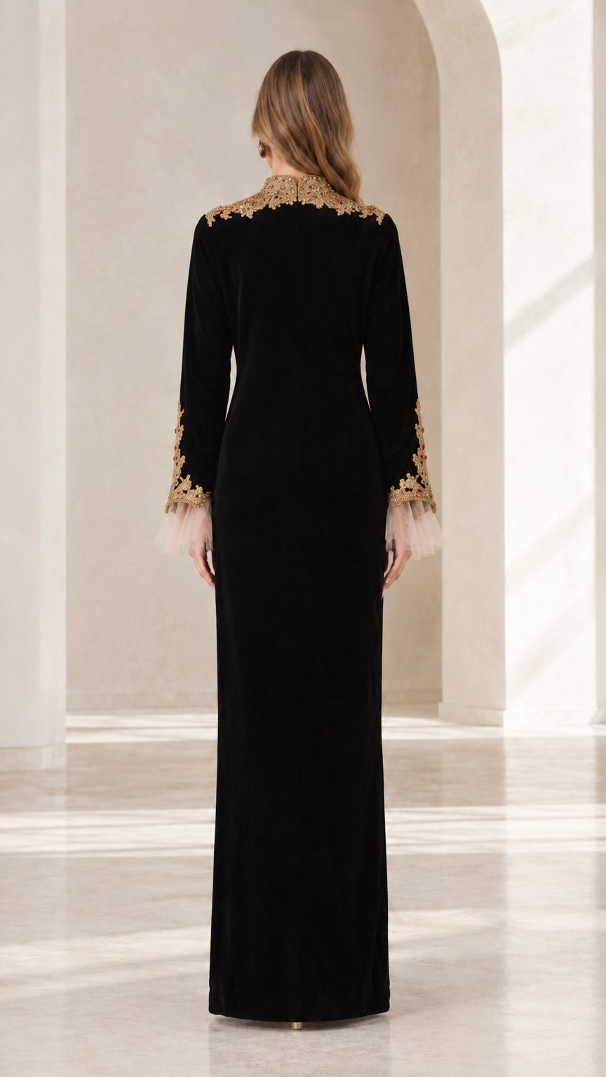 Back view of black velvet floor length dress showing clean column silhouette