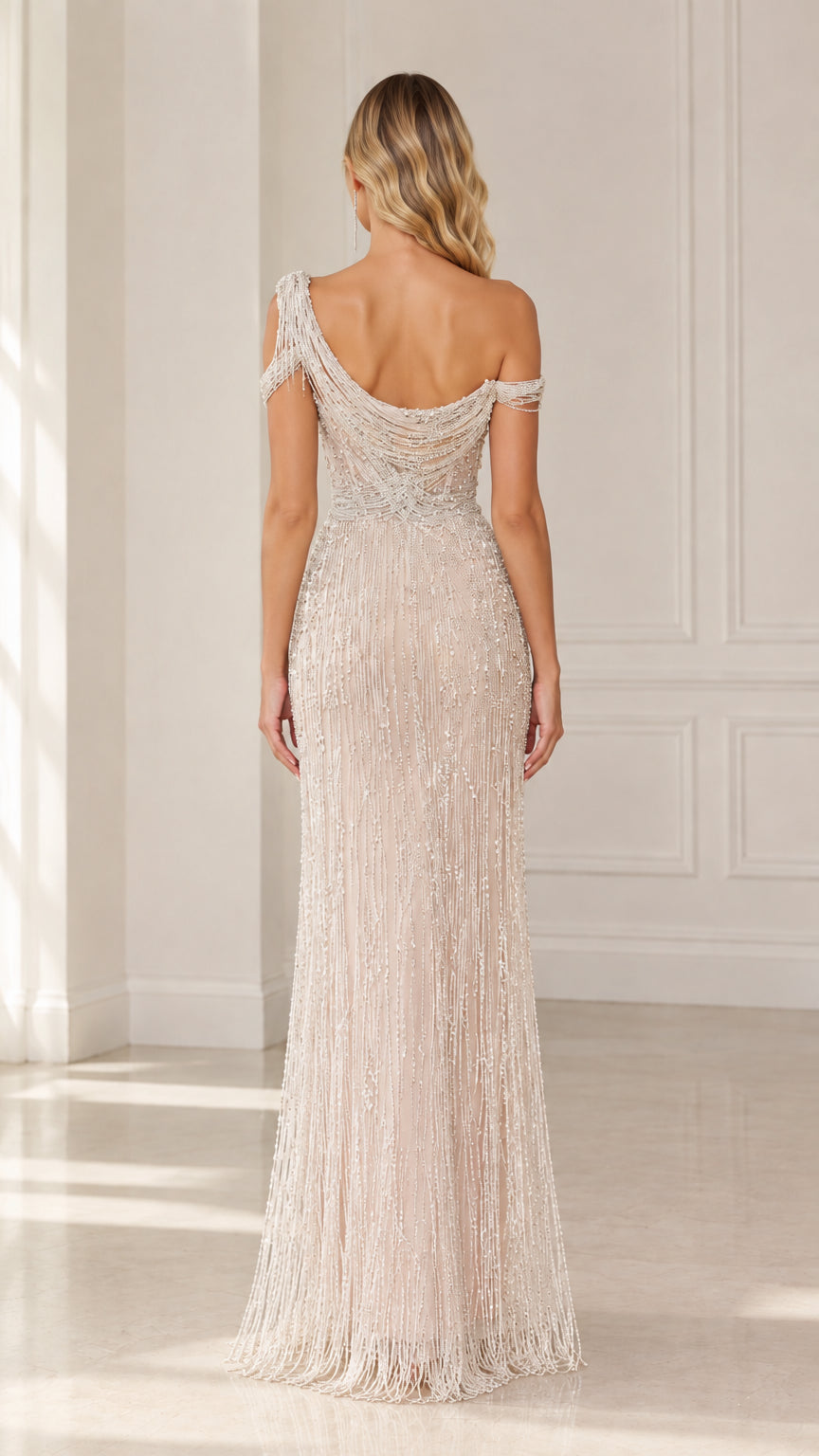 Back view of model showing draped cowl back and beaded details on Champagne maxi gown