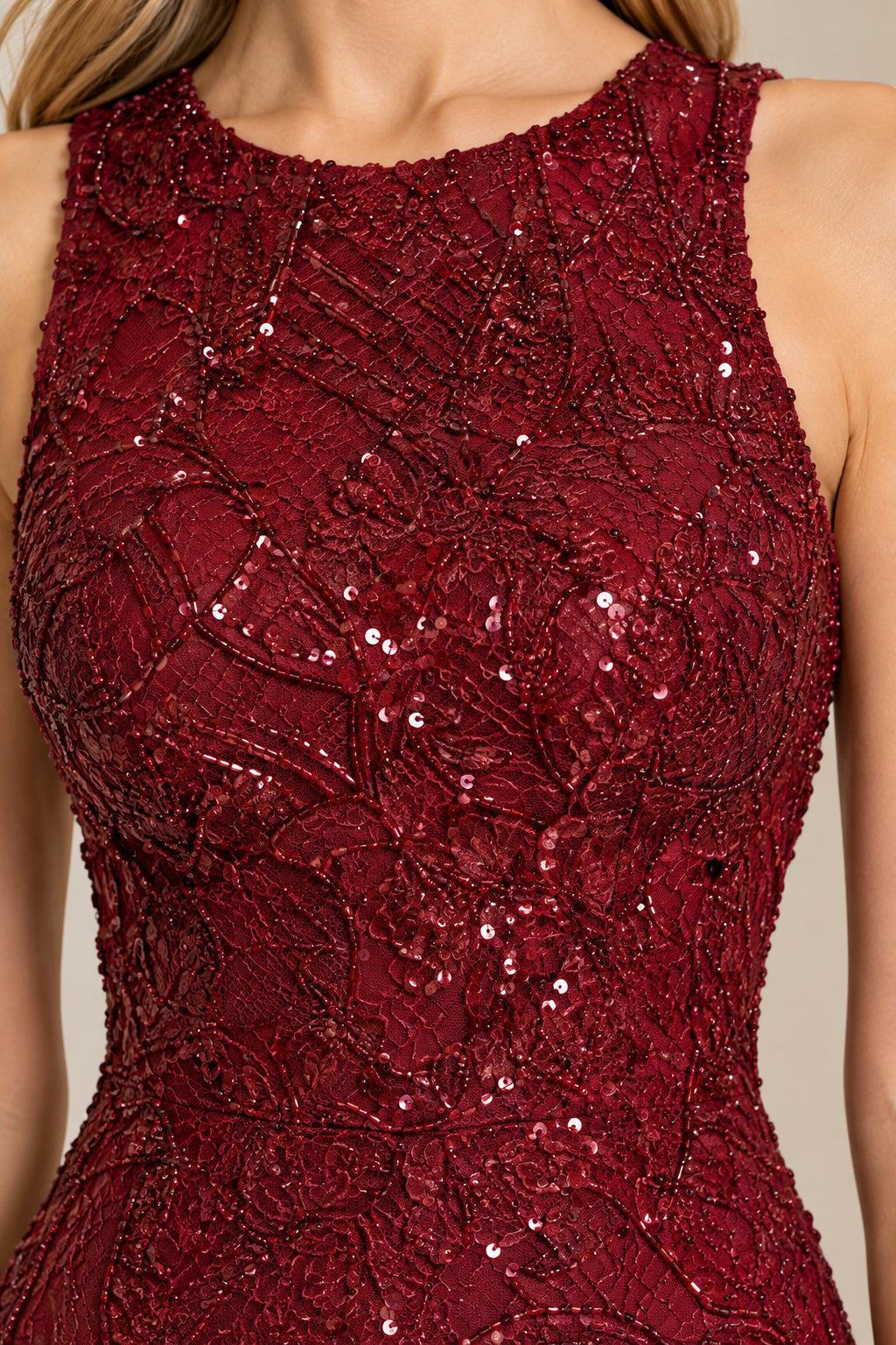Close-up detail of burgundy sequin and lace embroidery and high jewel neckline