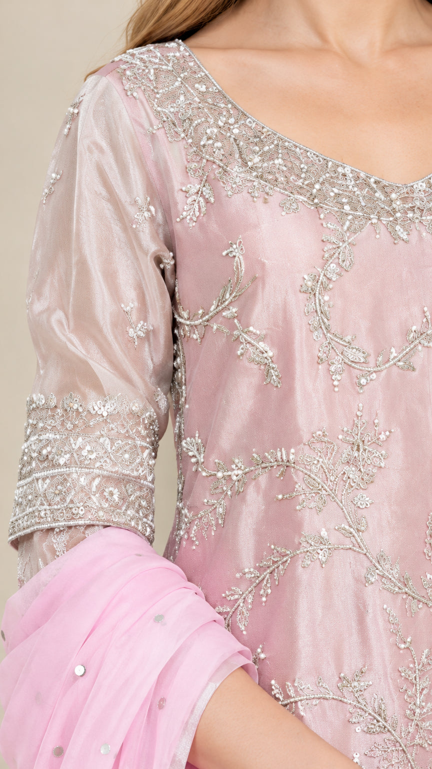 Close-up detail of silver embroidery, scoop neckline, and 3/4 sleeves on Blush Pink kurta