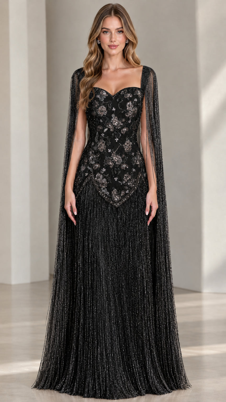 Model wearing black beaded cape sleeve fringe formal gown