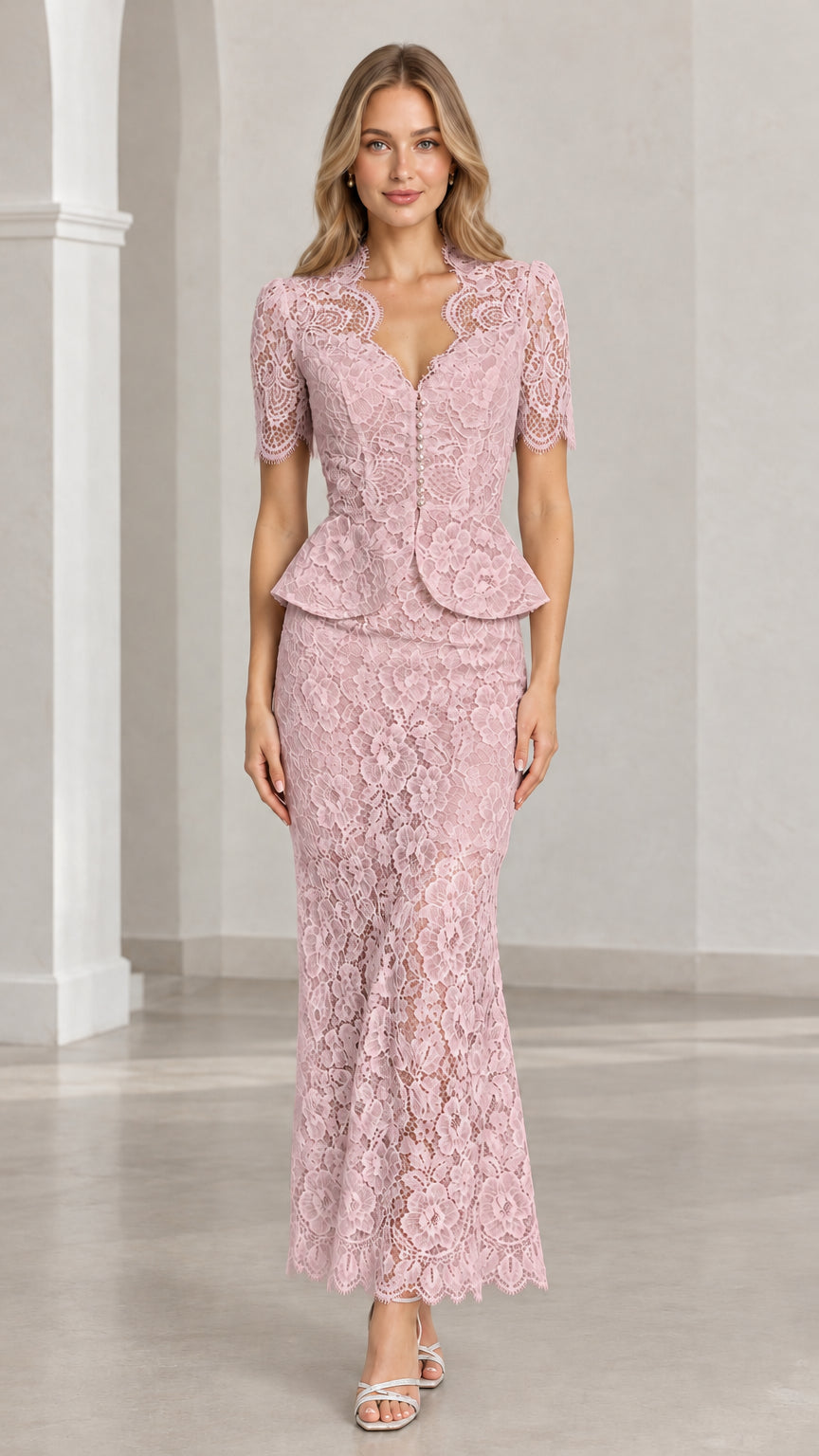 Front view of woman wearing dusty pink floral lace peplum maxi two-piece set