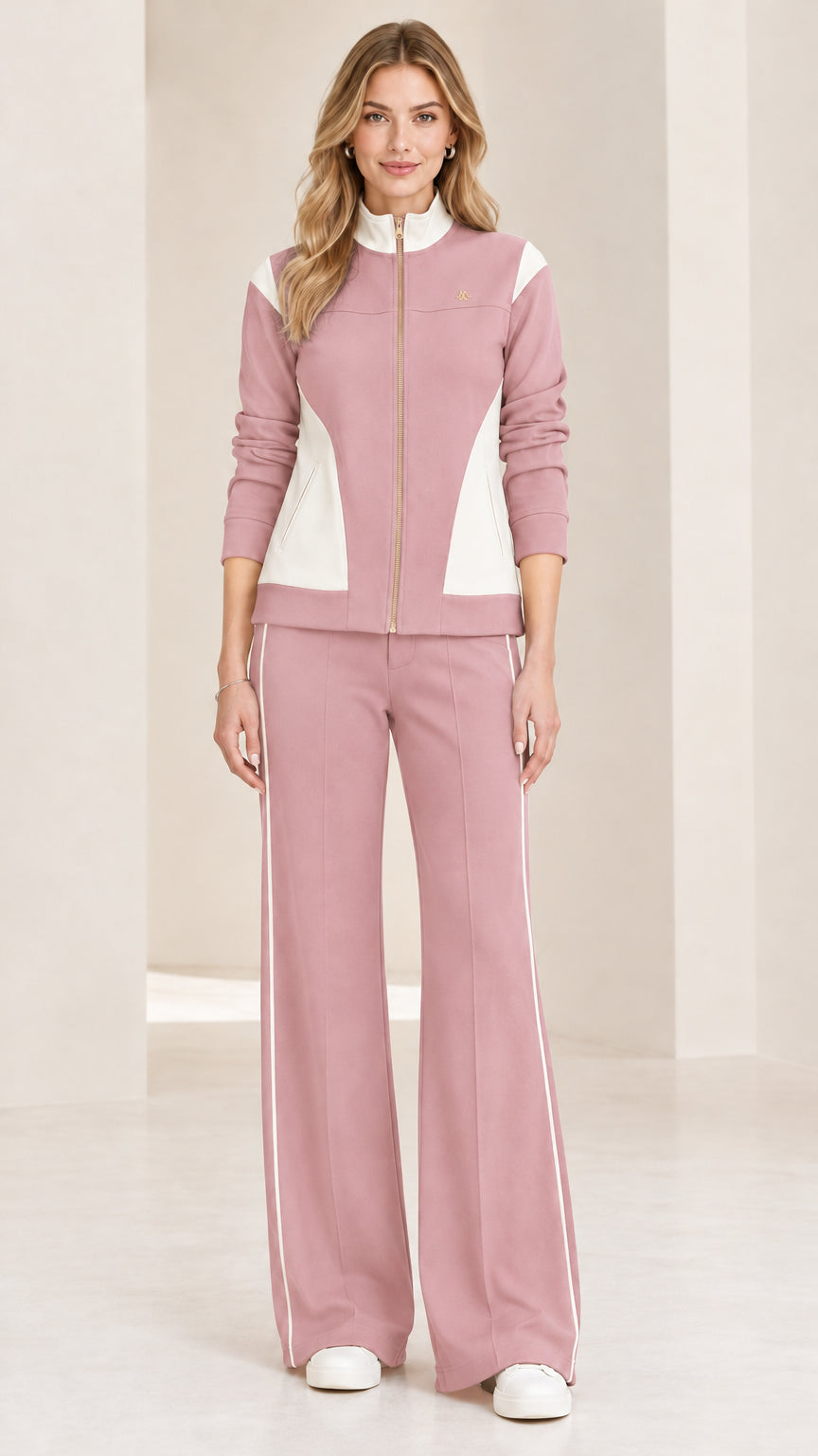 Front view of woman wearing dusty pink and white colorblock tracksuit set