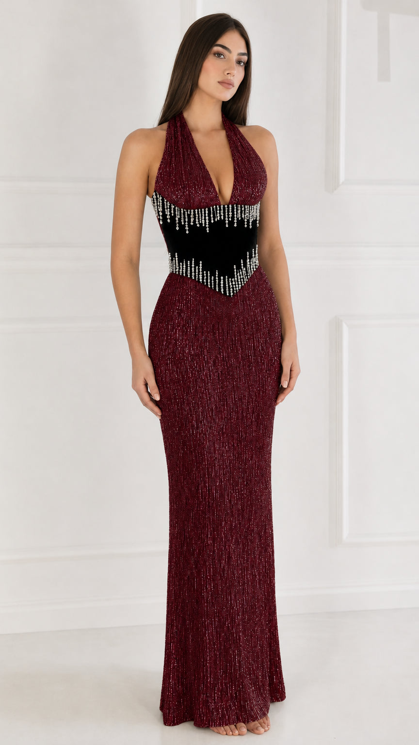 Front view of burgundy red halter maxi dress with rhinestone waist panel