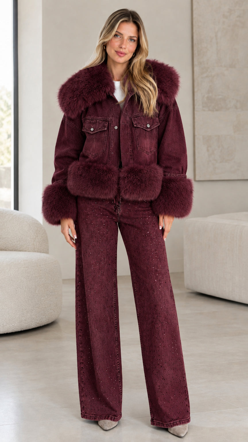 Model wearing burgundy wine denim jacket with matching burgundy faux fur trim and wide-leg jeans