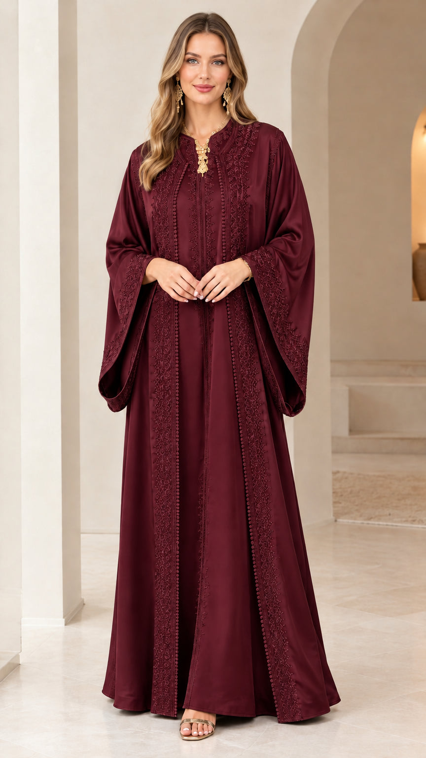 Front view of woman wearing burgundy wine red embroidered caftan maxi dress