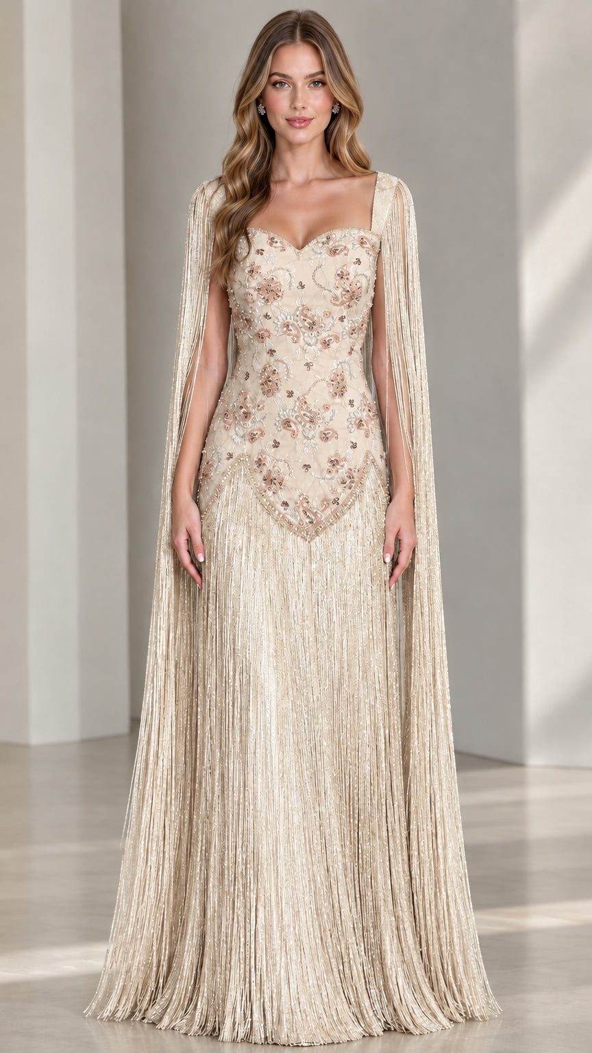 Model wearing champagne gold beaded fringe cape sleeve evening gown