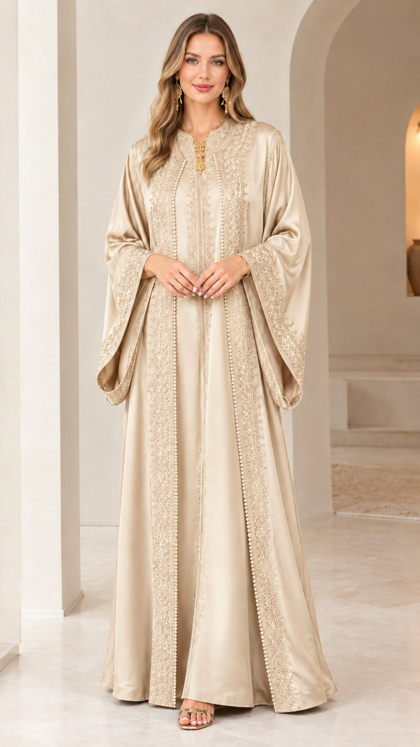 Front view of woman wearing champagne gold embroidered caftan maxi dress