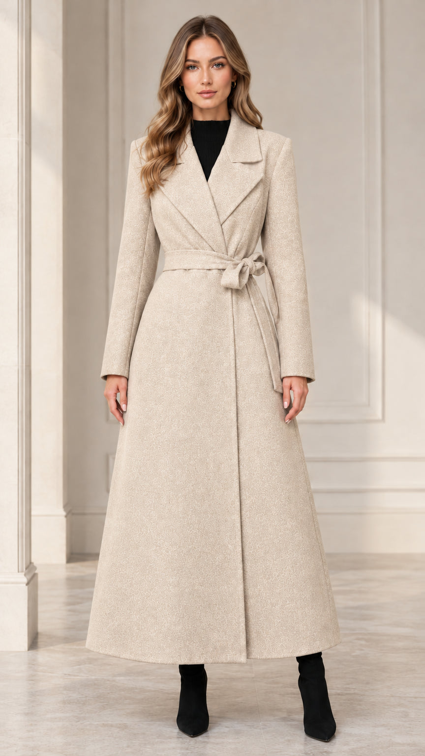 Front view of woman wearing the light beige belted maxi wrap coat