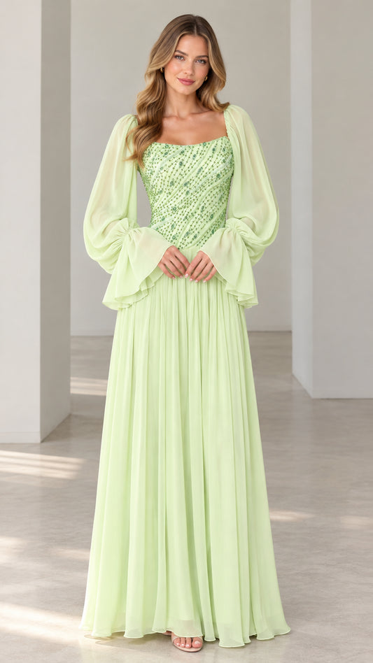 Front full-length view of mint green sequin bodice evening dress with long flounce sleeves