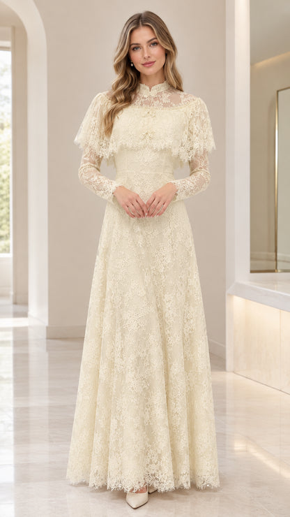 Front view of woman wearing ivory lace capelet maxi dress