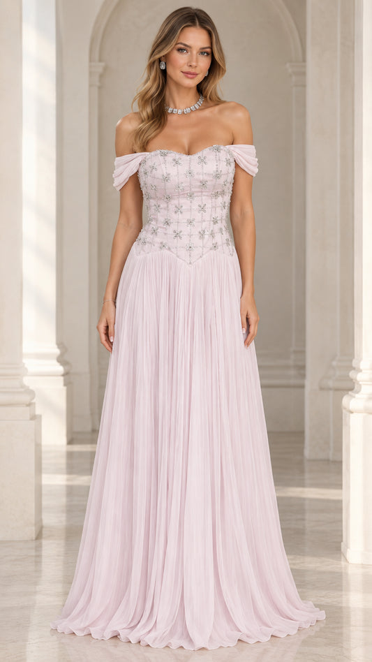 Front view of woman wearing blush pink off-the-shoulder beaded evening gown