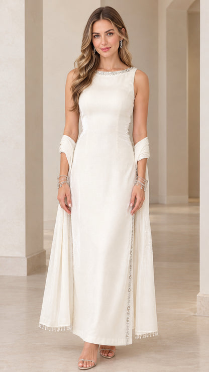 Front view of woman wearing ivory sleeveless formal maxi gown with beaded neckline and matching shawl