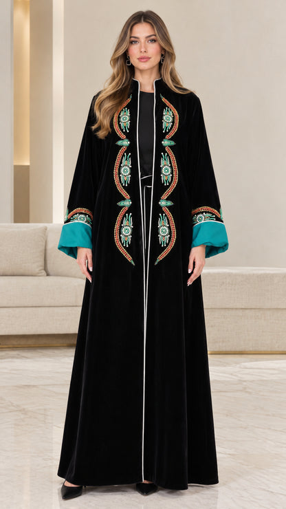 Front view of black embroidered velvet maxi abaya with contrast teal cuffs
