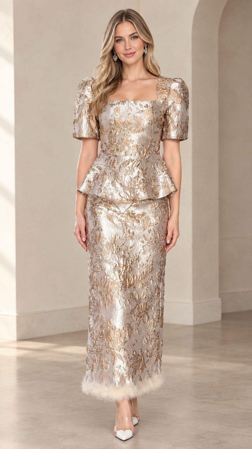 Front view of champagne metallic floral jacquard peplum top and maxi skirt set with plush trim