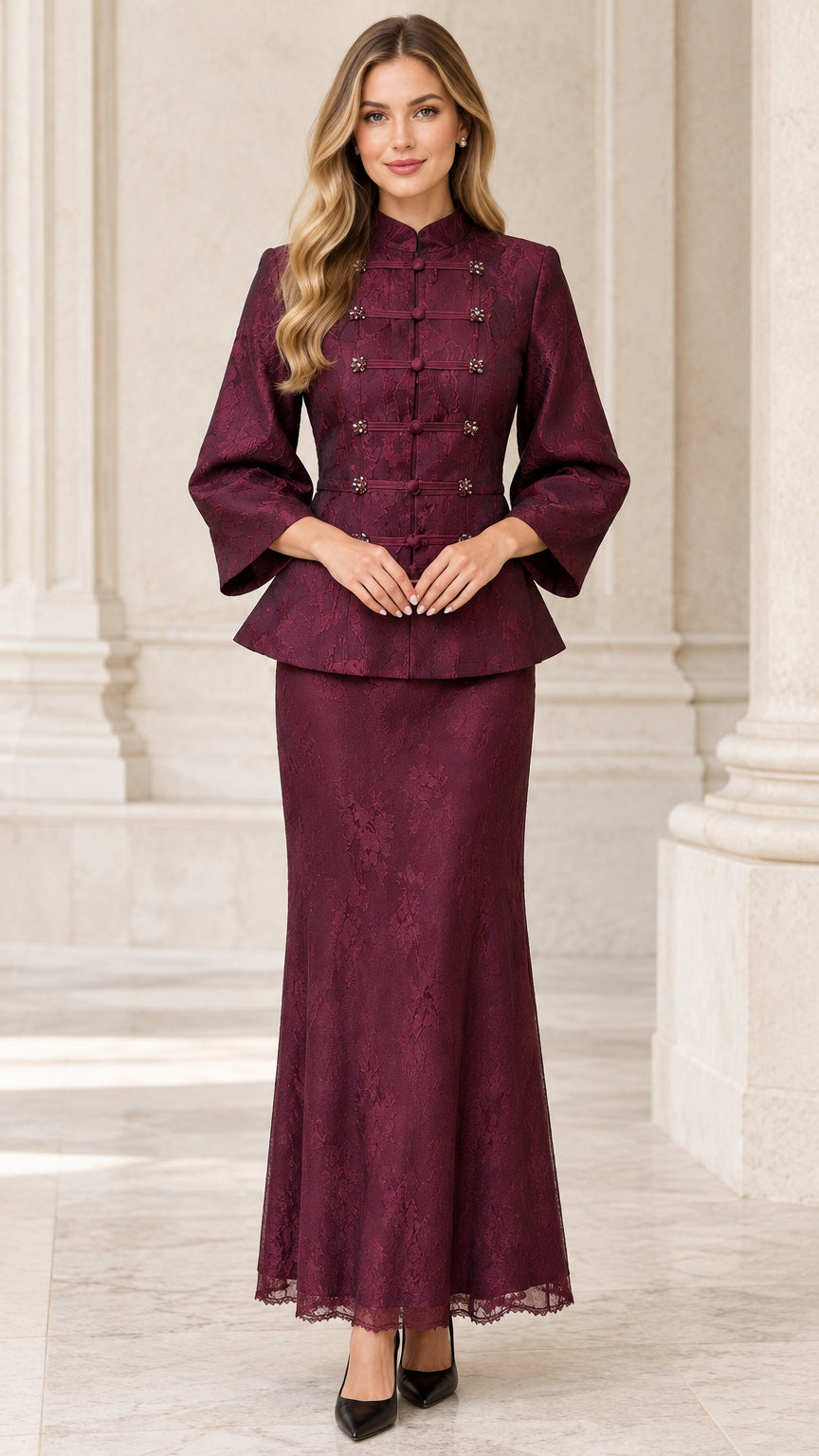 Front view of woman wearing burgundy lace peplum jacket and matching maxi skirt set