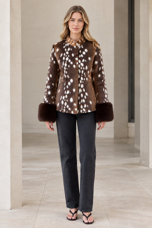 Front view of model wearing brown spotted fawn faux fur jacket with plush cuffs
