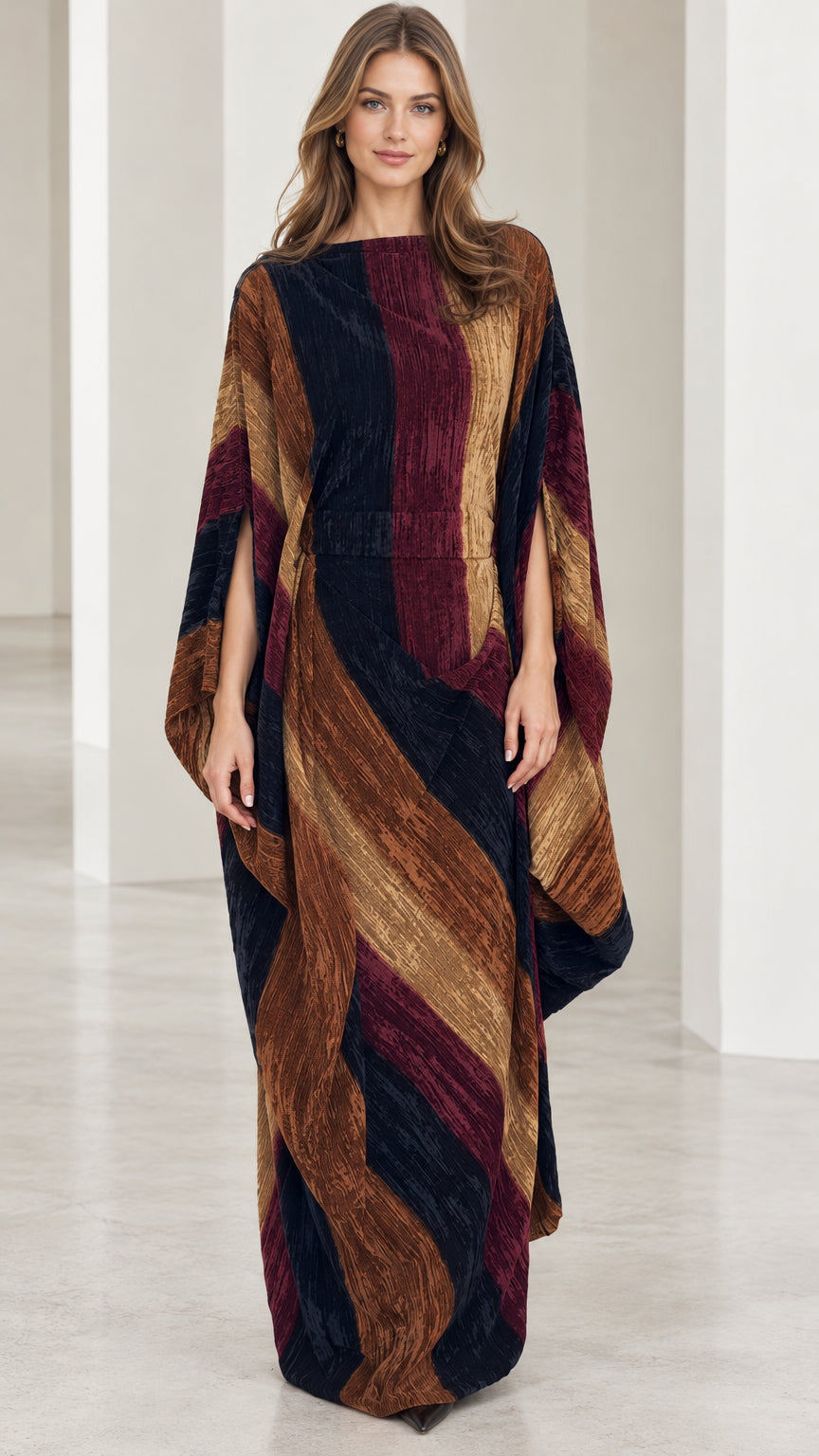 Front full-length view of model wearing burgundy multi striped cape kaftan maxi dress
