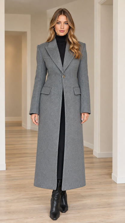 Front full-length view of model wearing grey tailored single-button maxi coat