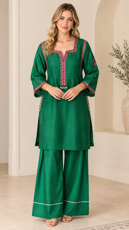 Front view of model wearing Emerald Green embroidered tunic top and palazzo pants set
