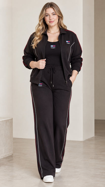 Full front view of model wearing the black contrast piping tracksuit set with zip jacket and wide-leg pants