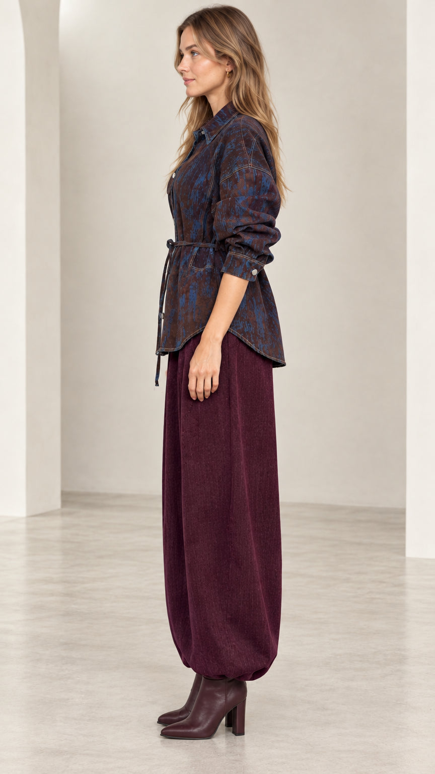 Side profile view of model wearing Coffee Blue belted button-down shirt jacket