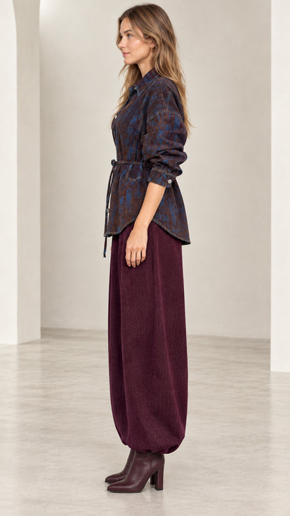 Side profile view of model wearing Coffee Blue belted button-down shirt jacket