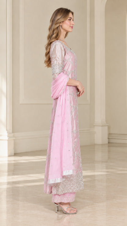 Side view of model wearing Blush Pink embroidered kurta suit ensemble