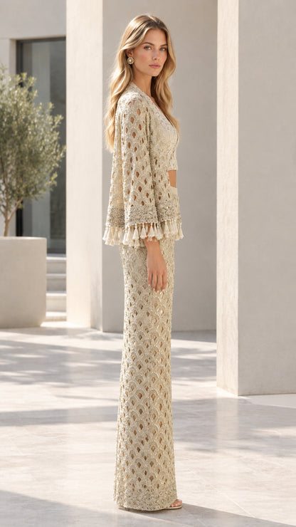 Side angle view of woman wearing Champagne 3-piece formal maxi skirt and jacket set