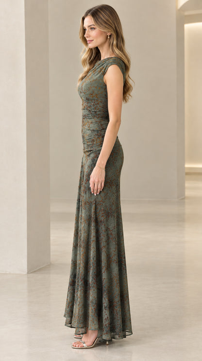Side profile of model in olive green ruched floral evening dress