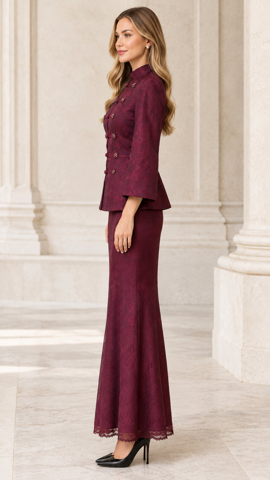 Side profile view of woman modeling burgundy lace evening skirt suit
