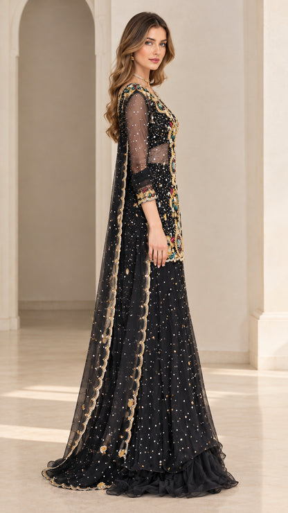 Side angle view of black embroidered evening sharara suit