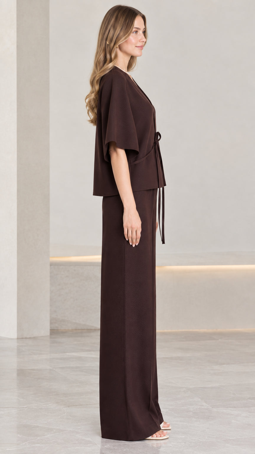 Side profile view of chocolate brown two-piece kimono top and wide-leg trousers set