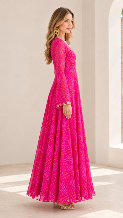 Side profile view of hot pink printed flared maxi dress