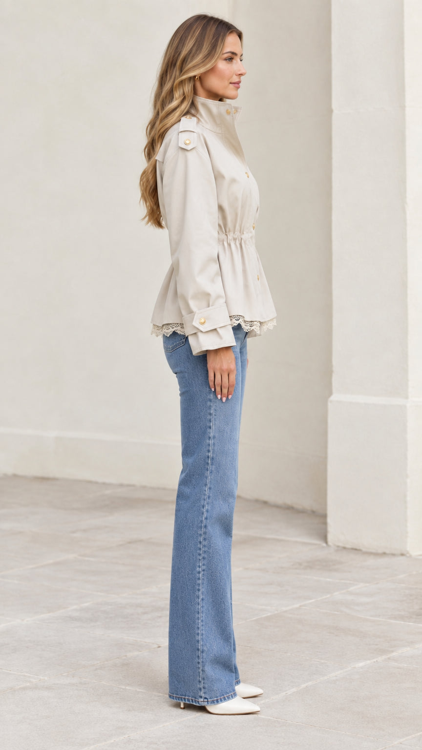 Side profile view of beige lace trim utility jacket showing waist cinch and sleeve detail