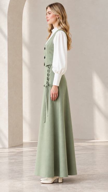 Side profile view of sage green vintage vest and maxi skirt set