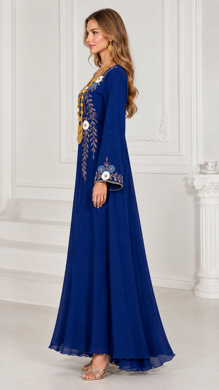 Side profile view of flowing royal blue embroidered kaftan dress