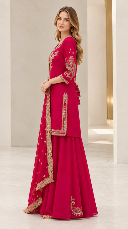 Side profile view of fuchsia embroidered sharara suit set